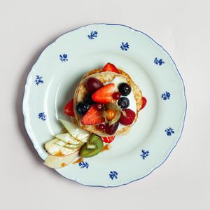 Pancakes with cream and fruit