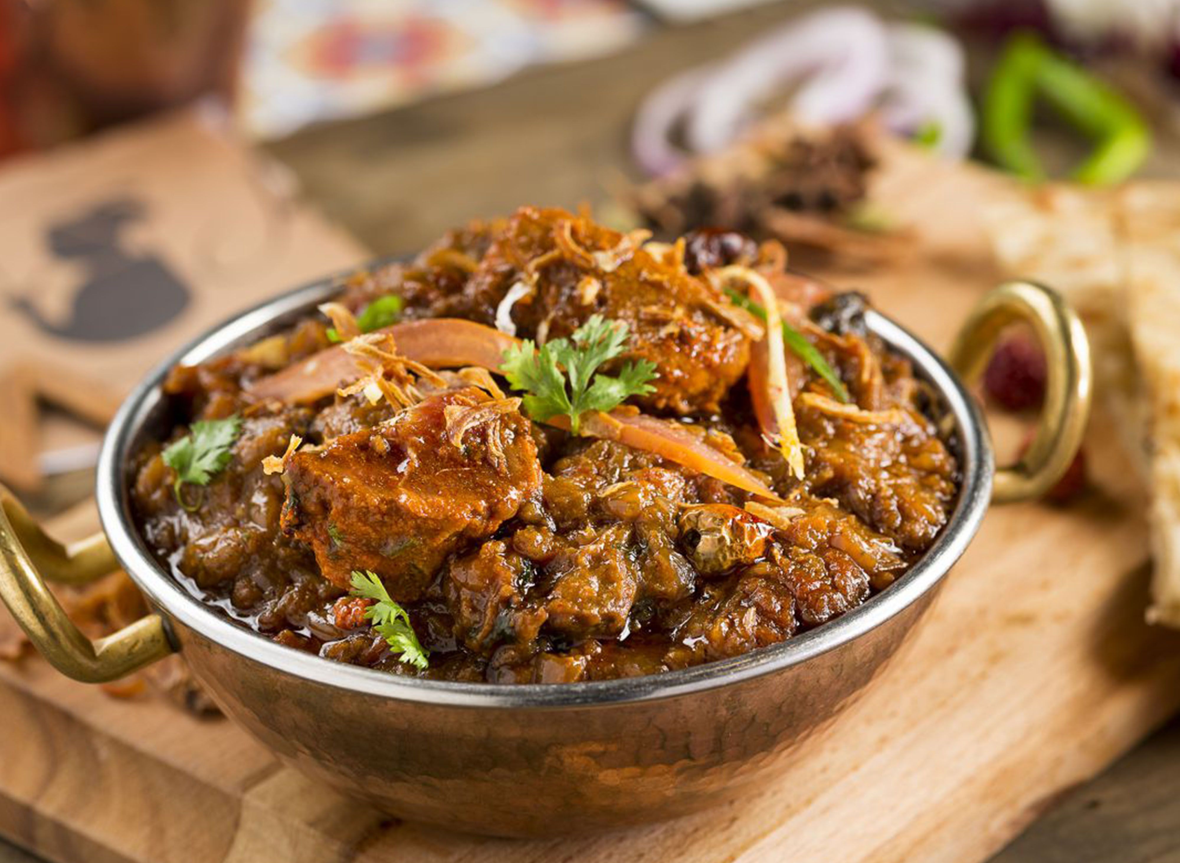 Mutton Brown Karahi in a traditional copper karahi