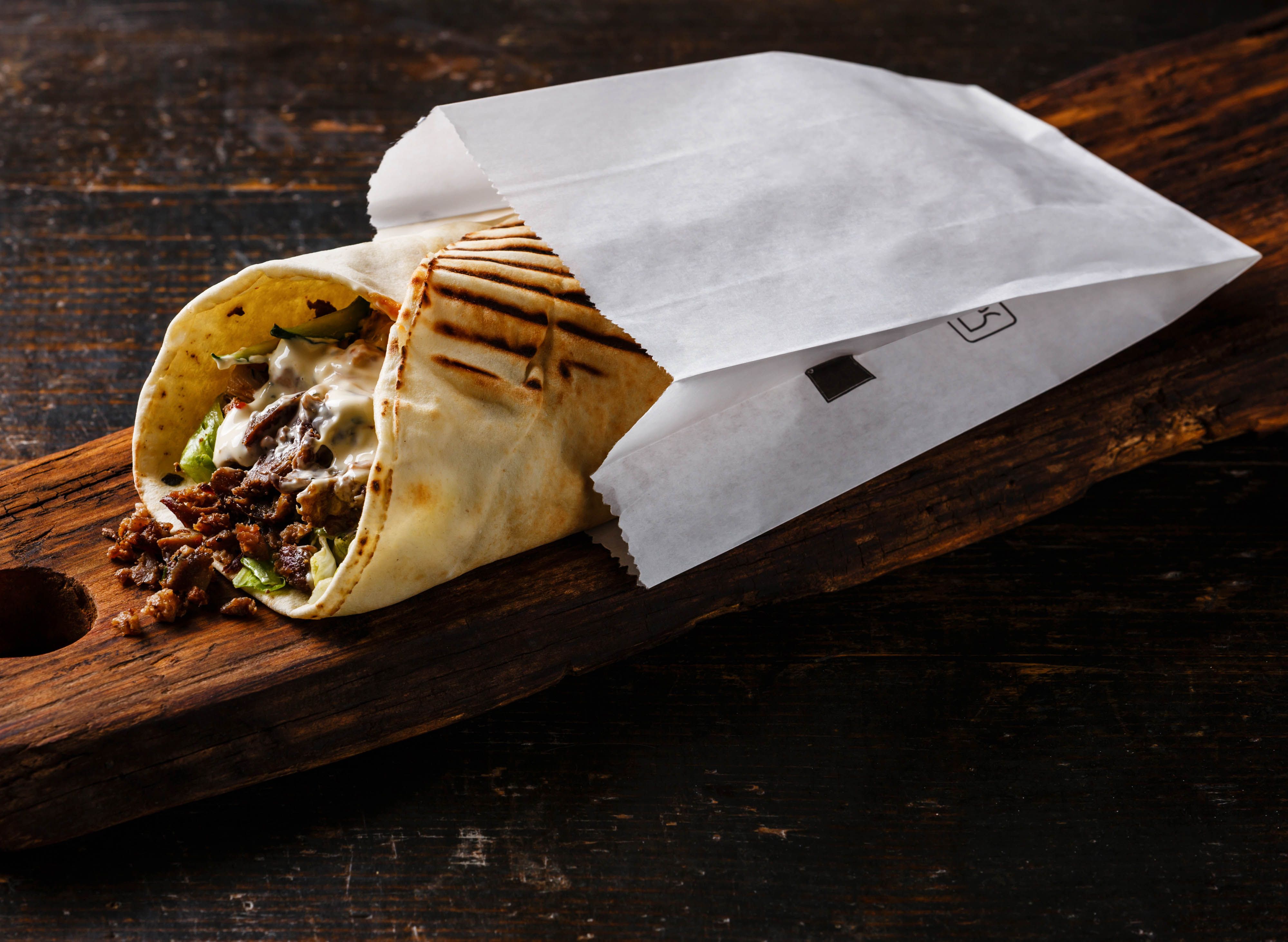 Shawarma with French Fries and Cheese. Boiled vegetables and rice on a  black background. Wallpaper for restaurants Stock Photo - Alamy