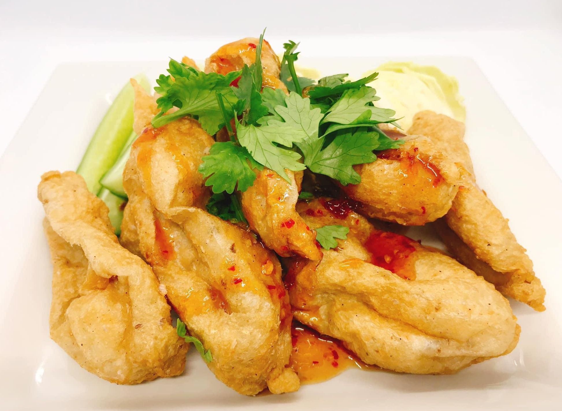 Zumo Look Chin Pla Rabert Spicy meatball salad next to 711 Sri Bua Ban