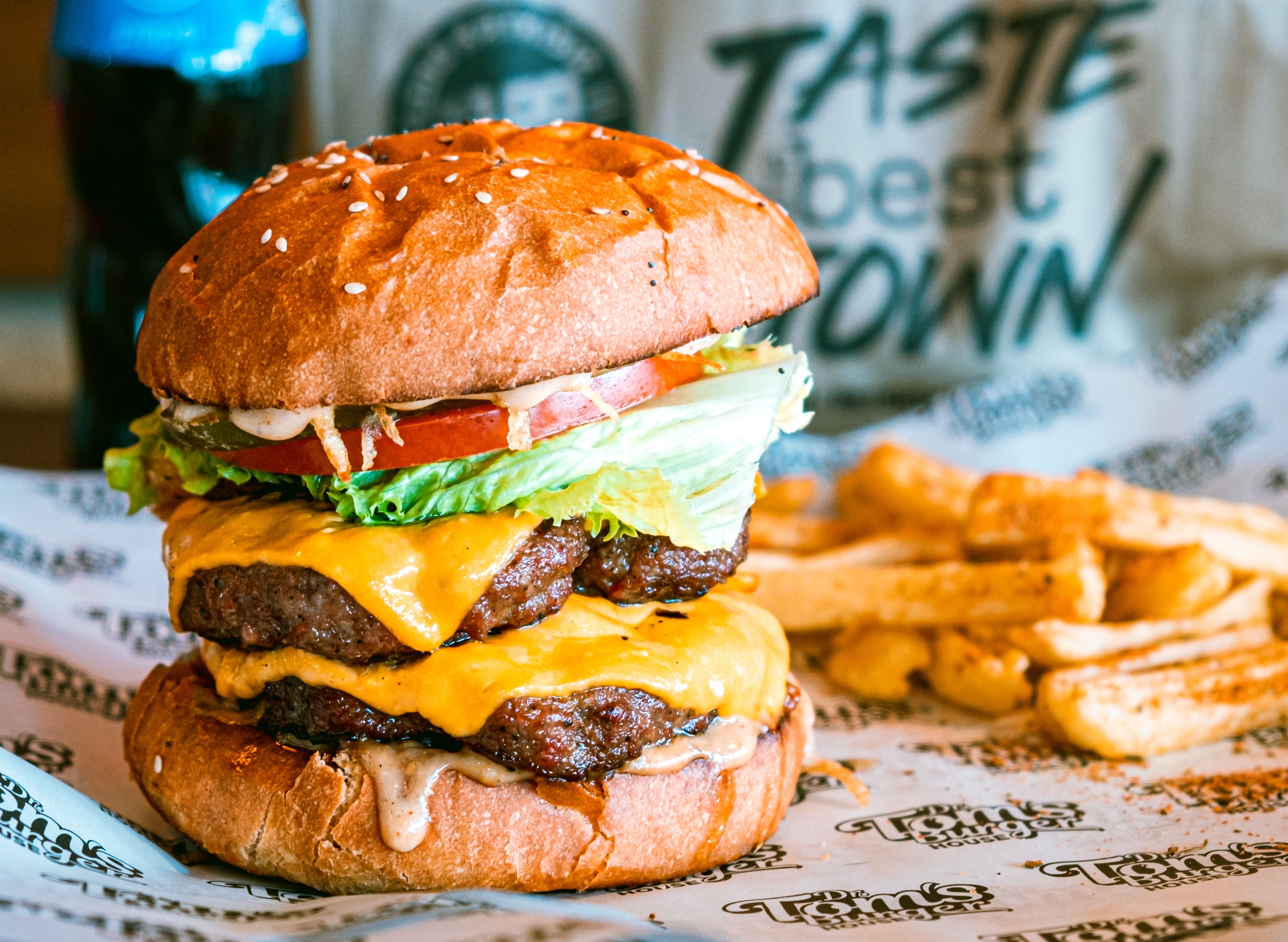 Tom's Burger House vendor logo