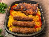 3 Kofta pieces, a quarter grilled chicken thigh with rice