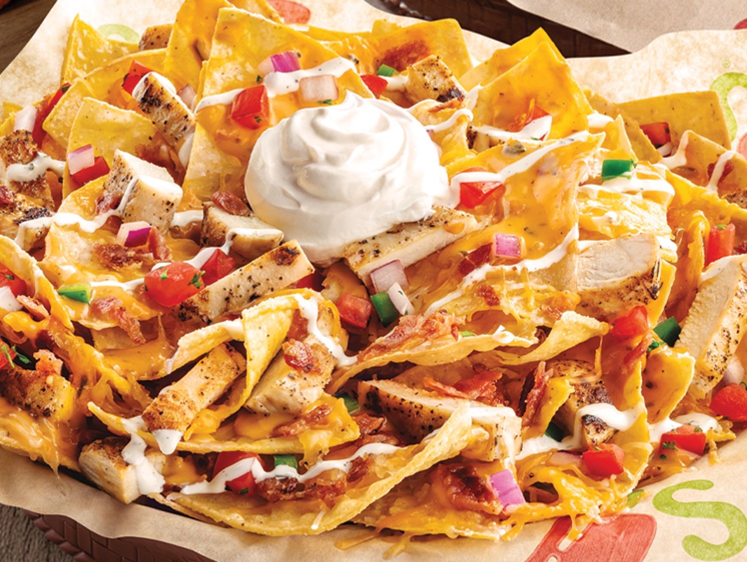 Chicken Beef Bacan And Ranch Sauce Nachos