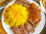 Stuffed pigeon with rice, kofta, and kebab