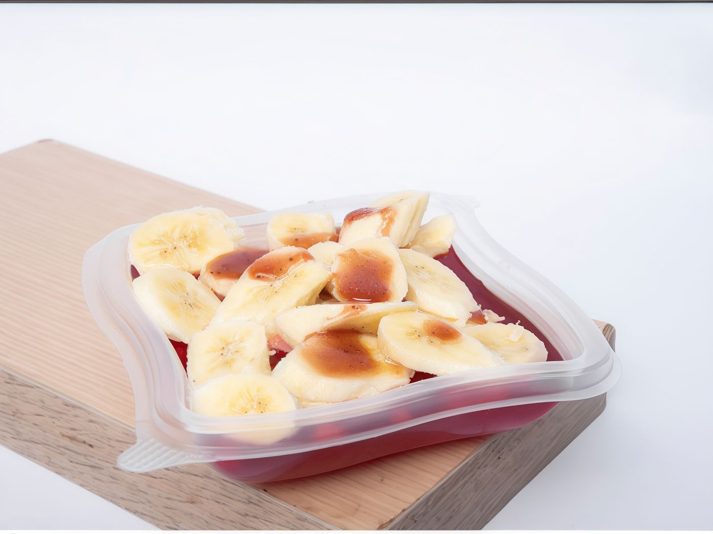 Jelly With Banana And Strawberry Sauce