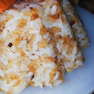 A dish of rice grain by grain