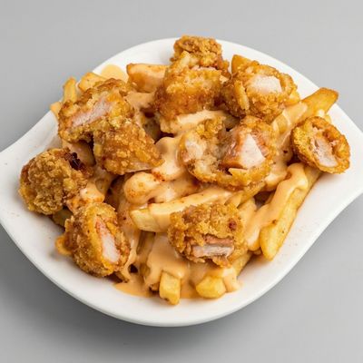 Potatoes with chicken and cheese sauce