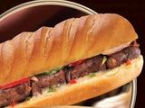 Grilled sausage sandwich in a fino bread.
