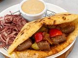 Grilled sausage sandwich with Baladi bread