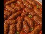 Tajin rice kofta with red sauce.