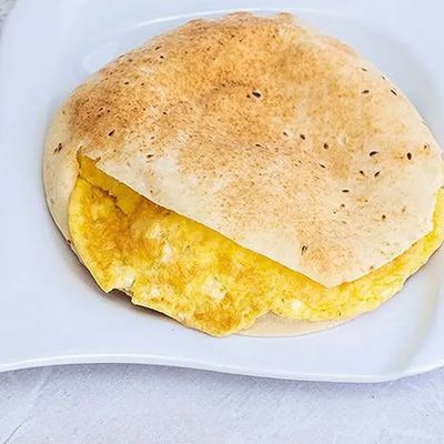Omelette Puree with Roumy Cheese on Musaka.