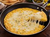 Omelette pan with mozzarella cheese and olives