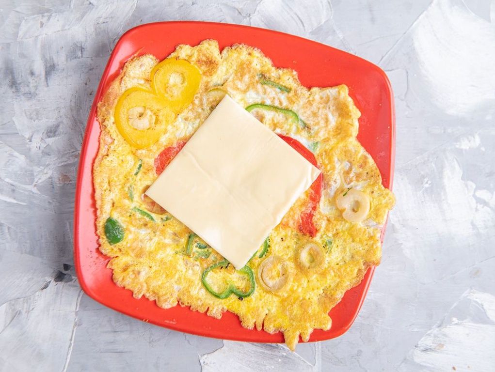 Omelette pan with cheddar cheese and olives