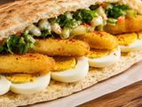 Shrimp and potatoes over boiled eggs