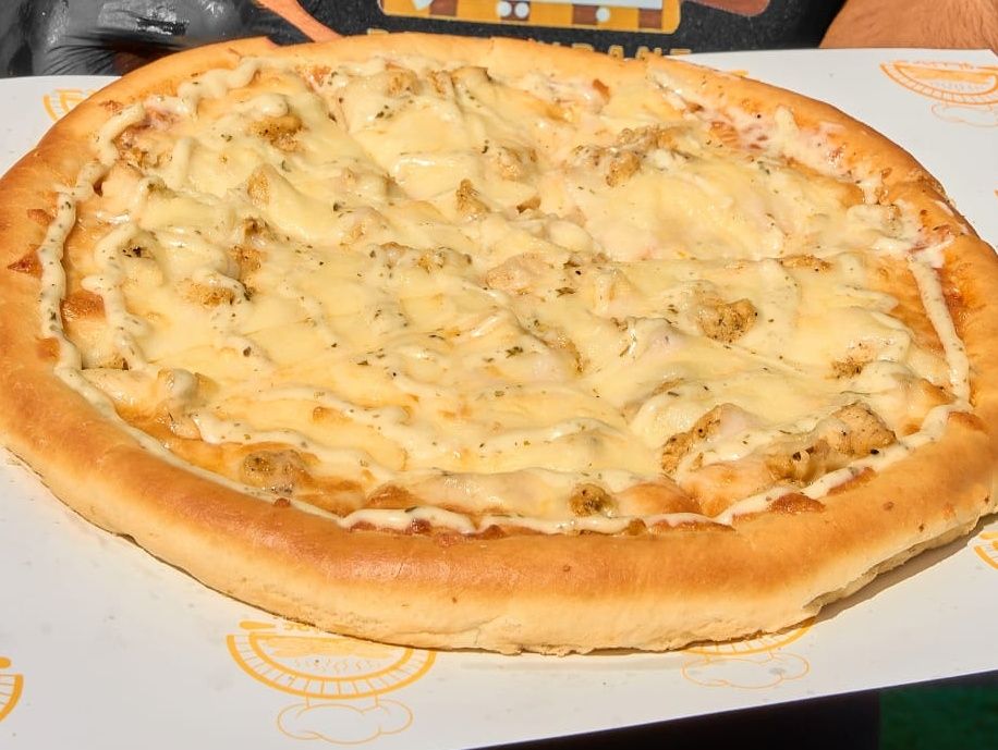 Oriental pizza with sausage and Kiri cheese
