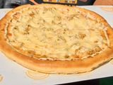 Oriental pizza with sausage and Kiri cheese