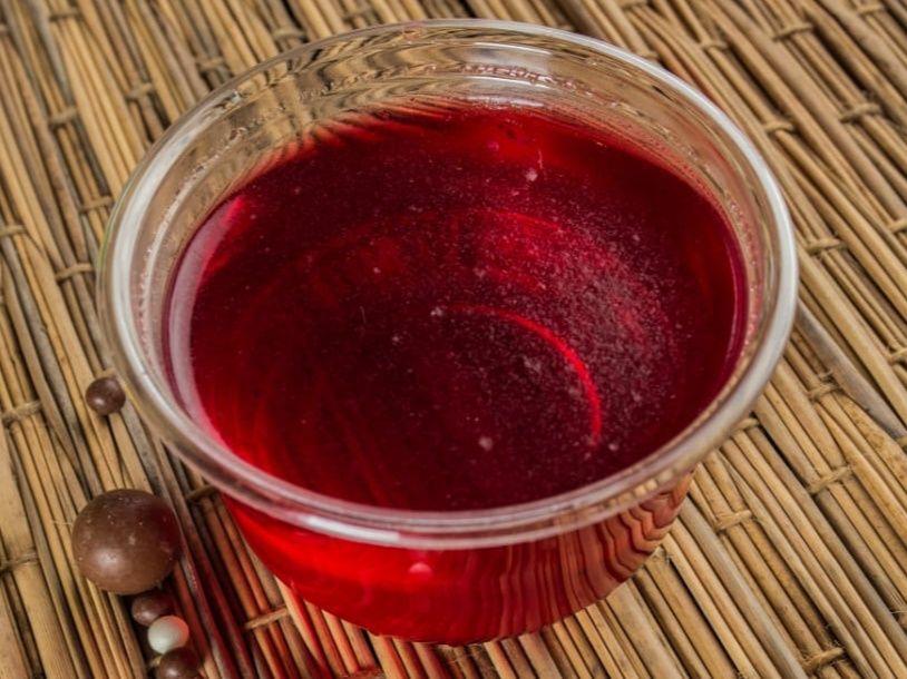 A cup of strawberry jelly