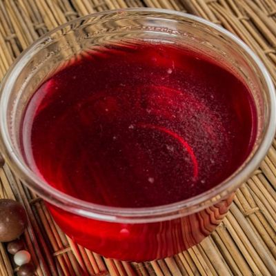 A cup of strawberry jelly
