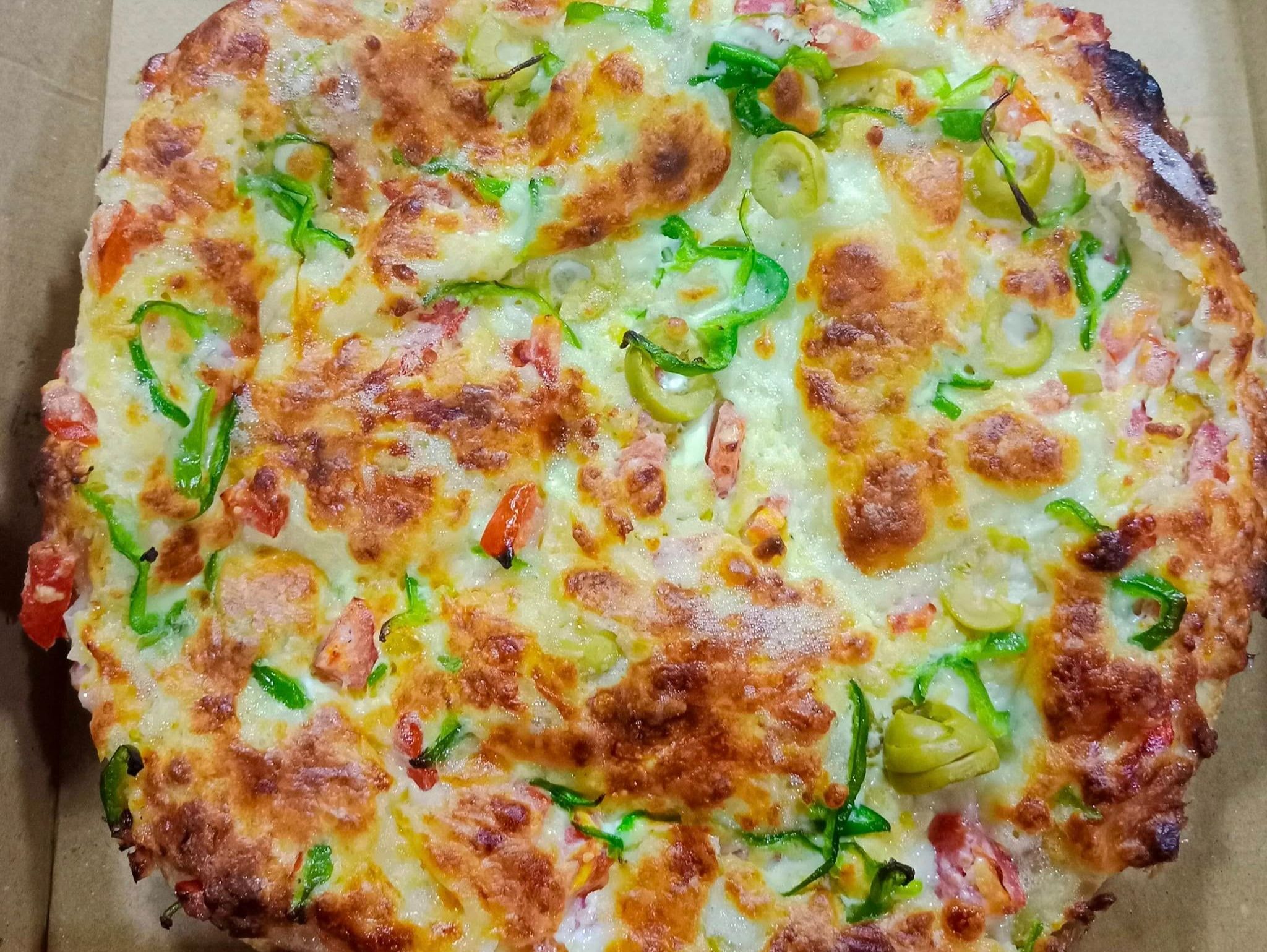 Oriental pizza with local sausage