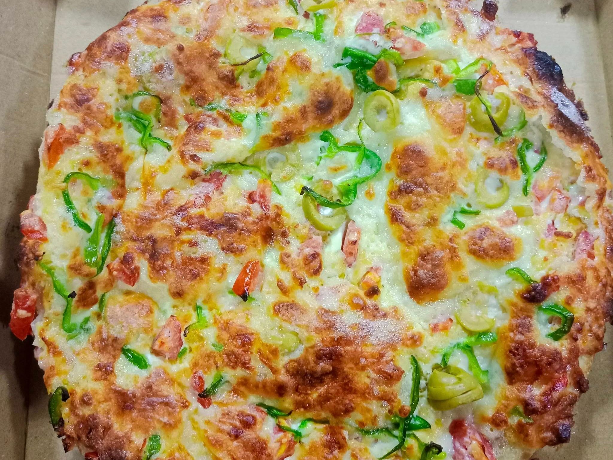 Oriental pizza with sausage and Kiri cheese