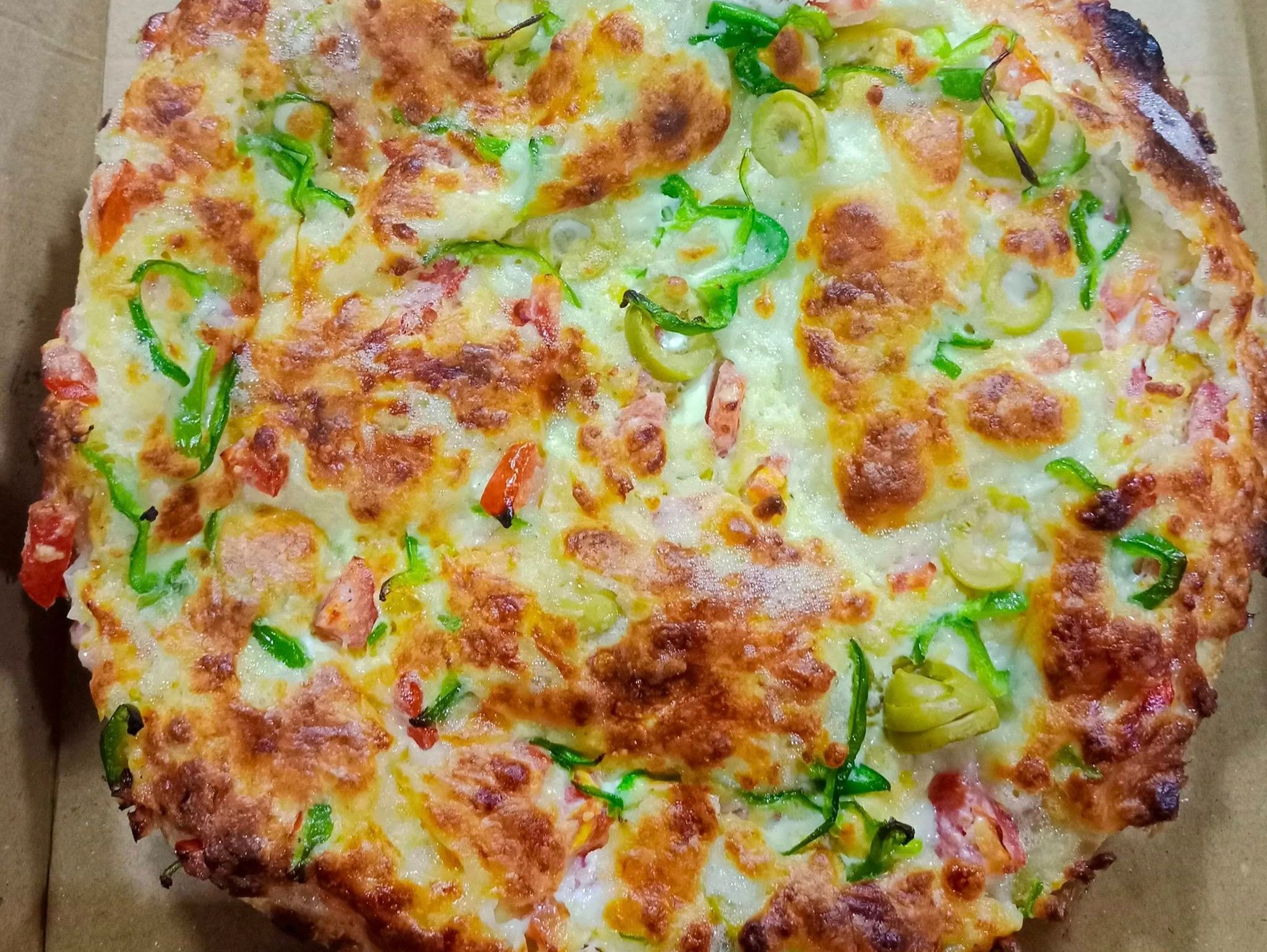 Oriental pizza with baladi sausage and Kiri cheese