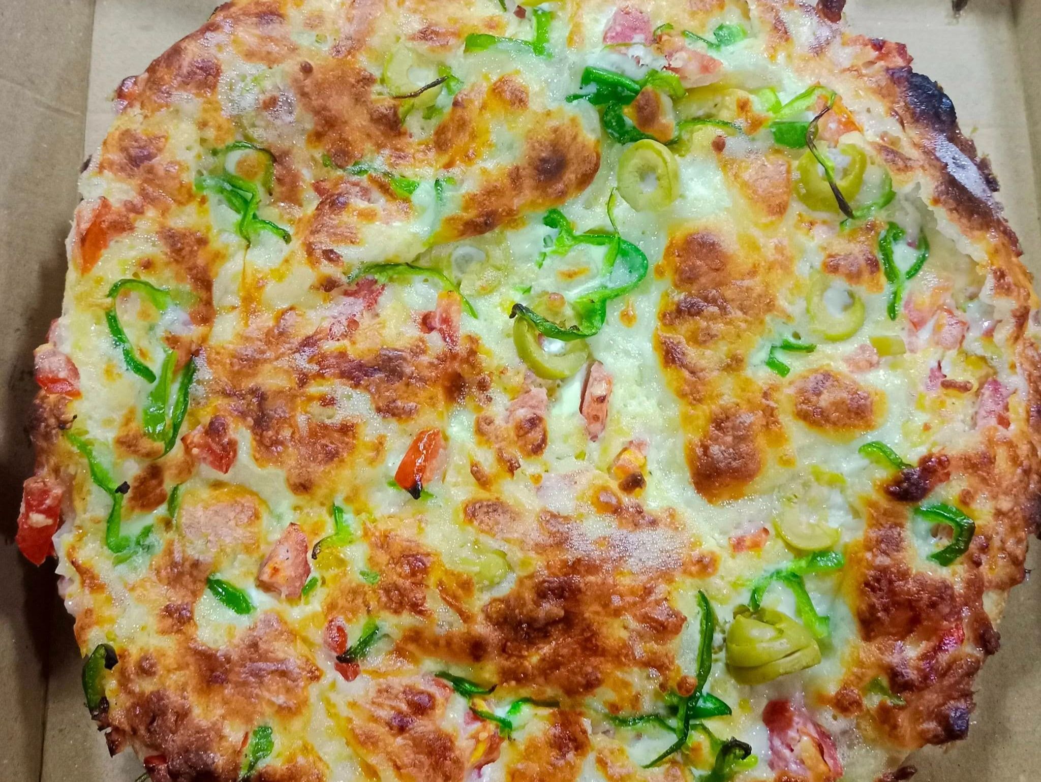 Oriental pizza with basturma and Kiri cheese