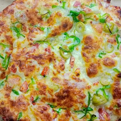 Oriental pizza with basturma and Kiri cheese
