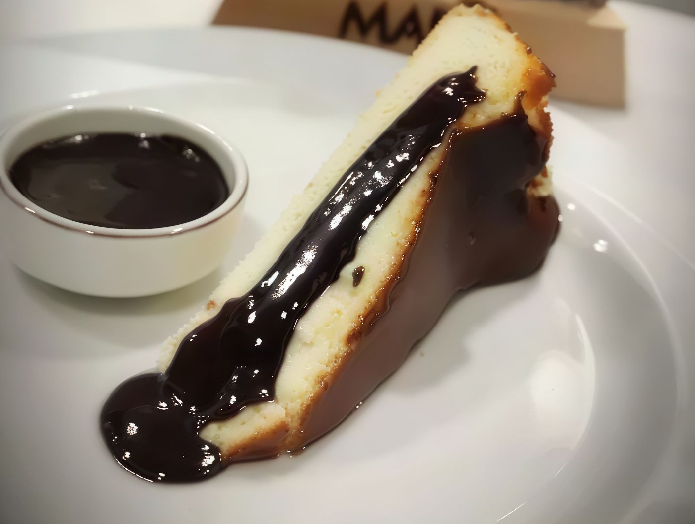 San Sebastian Cheesecake With Chocolate Sauce