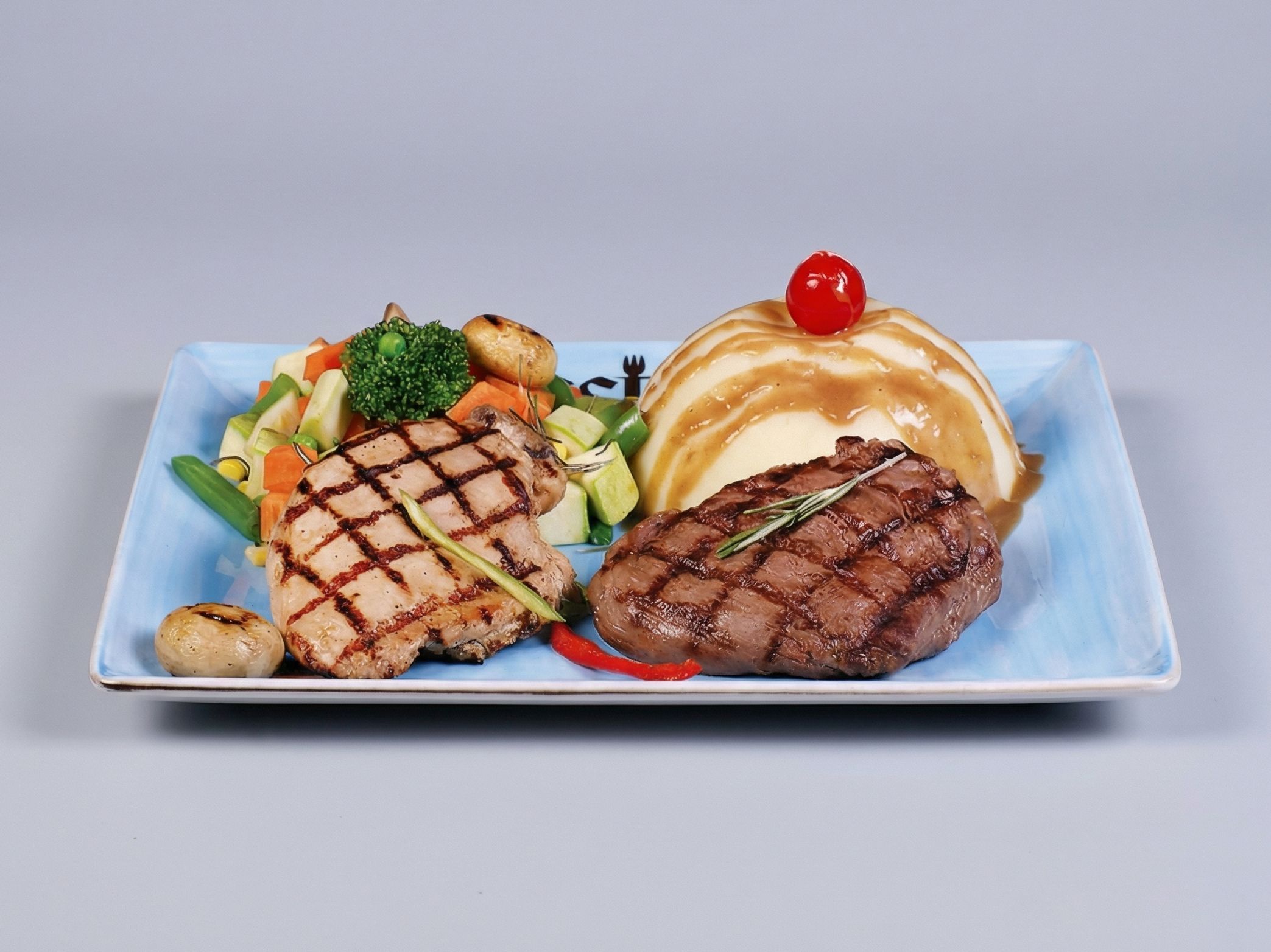 Grilled chicken and beef fillet dish