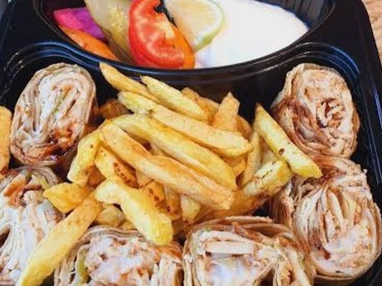 Smoked chicken Arabic shawarma meal.