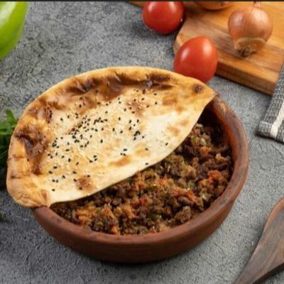 Casserole Of Mgarmsheh Meat With Vegetables