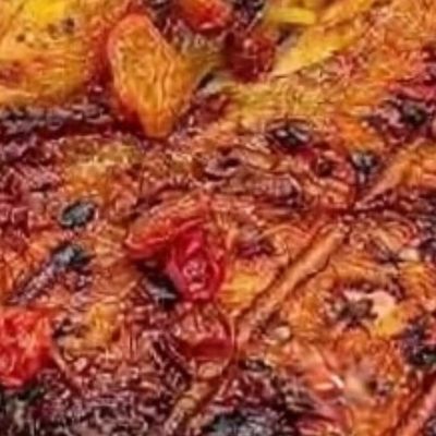 Quarter grilled chicken thigh