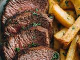 Roasted meat with French fries and rice