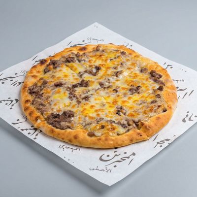 Minced meat Manousheh with a Sprinkle of Cheese