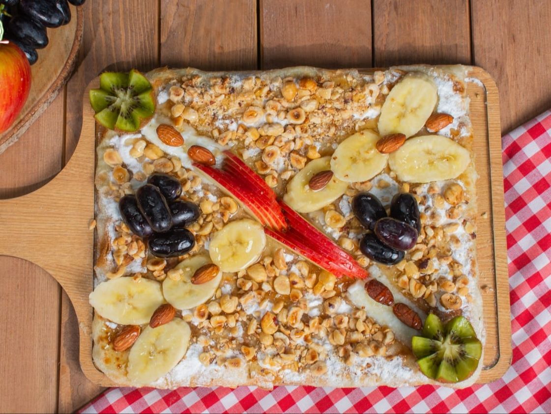 Cream with nuts and fruits pie