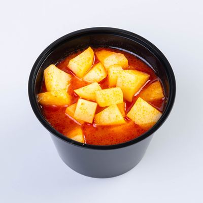 Cooked potatoes with red sauce