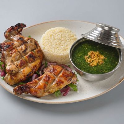 1/2 chicken with rice and vegetables meal