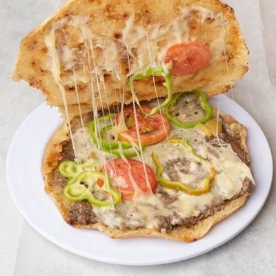 Hawawshi with cheddar cheese and vegetables
