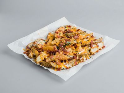 Wedges fries with cheese sauce