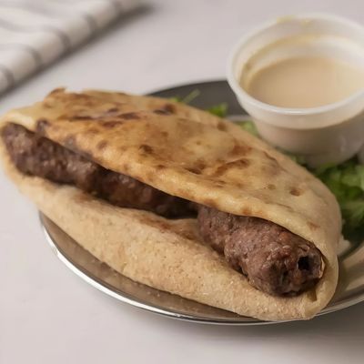 large Kofta sandwich on charcoal baladi bread