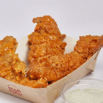 Fried chicken tender fingers with buffalo sauce
