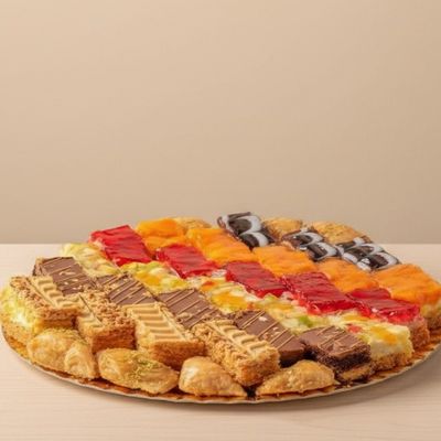 Large mixed plate of plain, cream, and qeshta