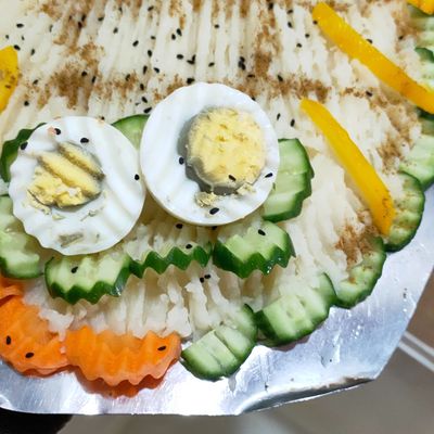 Mashed potato dish with boiled eggs