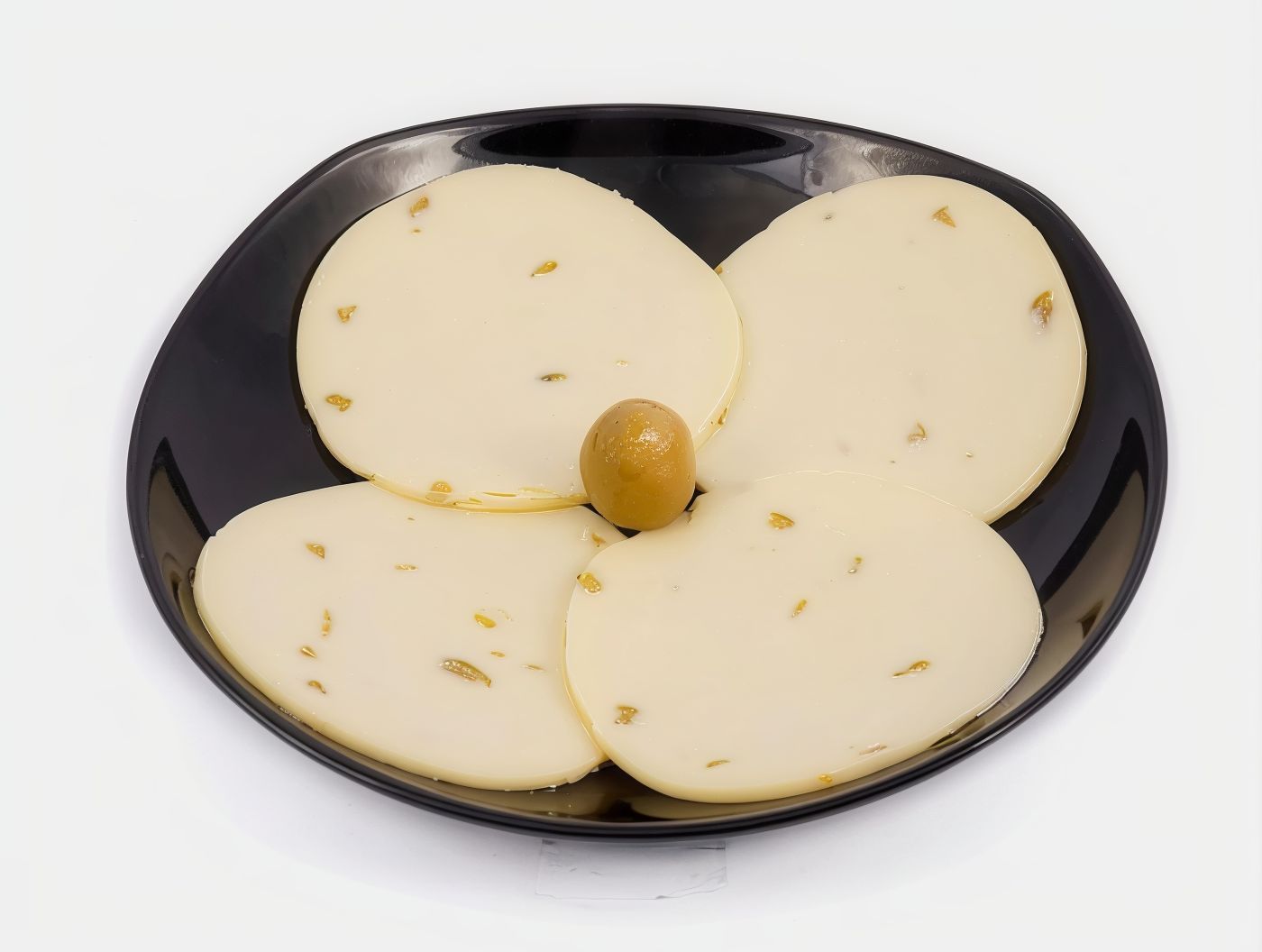 Quarter of cheddar with olives