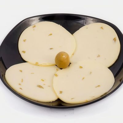 Quarter of cheddar with olives