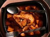Potato tray casserole with a quarter chicken and a thigh