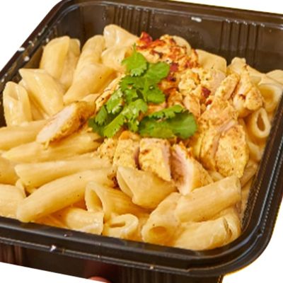 Penne pasta with white sauce and grilled chicken