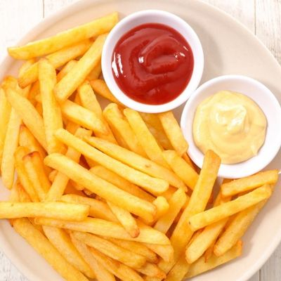 Large packet of French fries with ketchup and mayonnaise