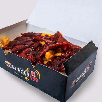 French fries with beef bacon, salami, and BBQ sauce