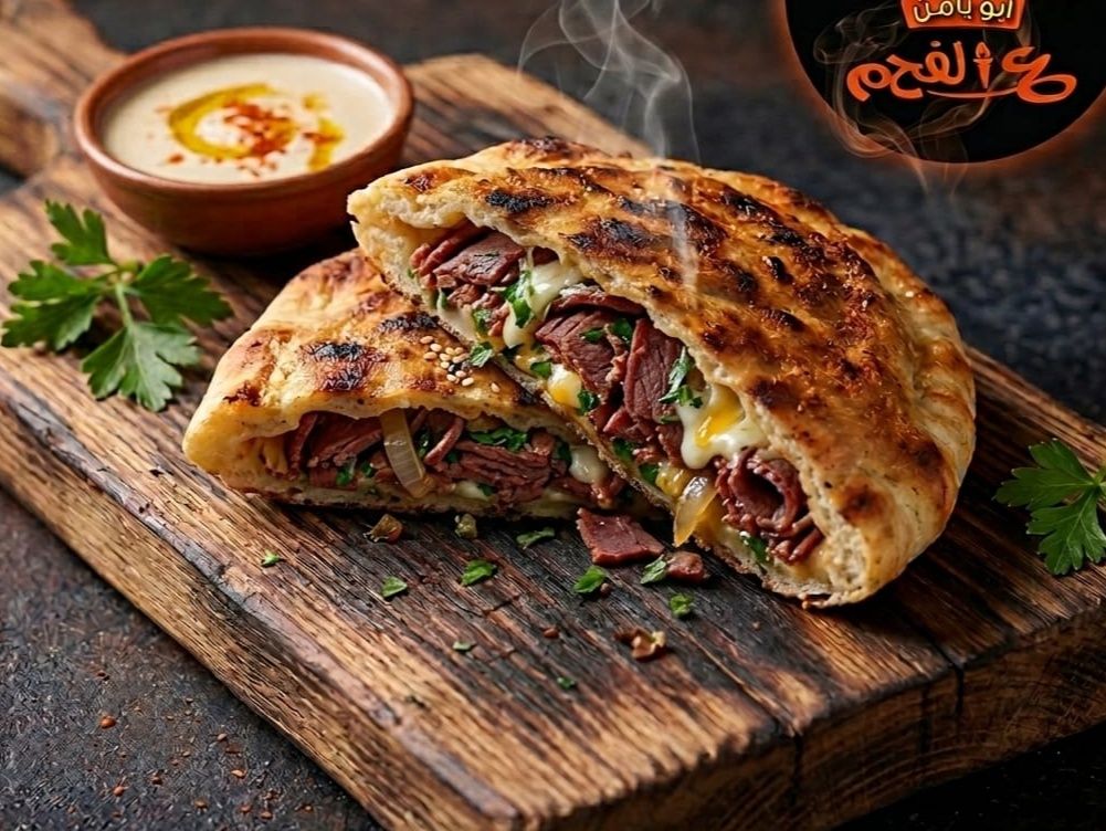 Charcoal-grilled pastrami hawawshi.